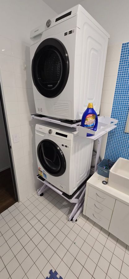 Real Space Combo showing a DryerStand freestanding tumble dryer stand in a real laundry space with a dryer above a washing machine
