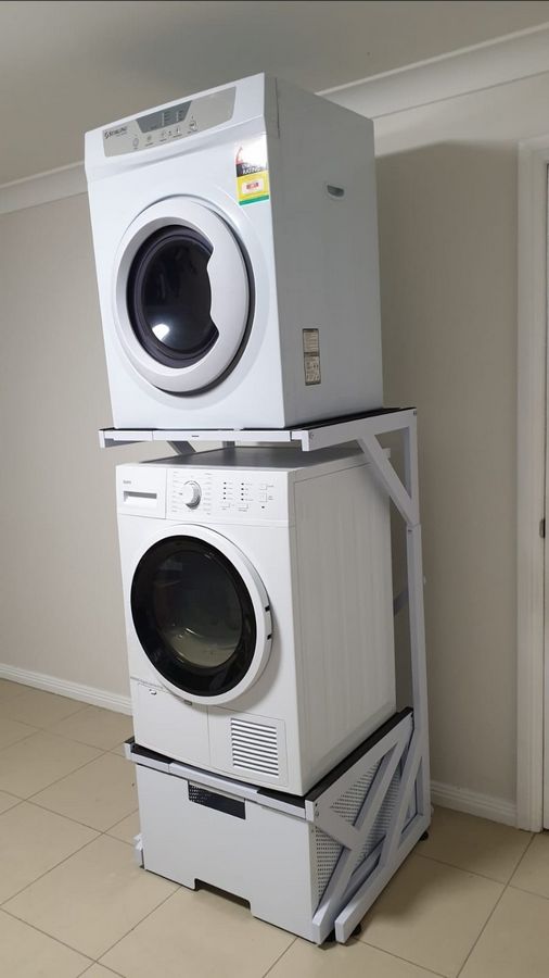 Real Space Combo showing a DryerStand freestanding tumble dryer stand in a real laundry space with a dryer above a washing machine