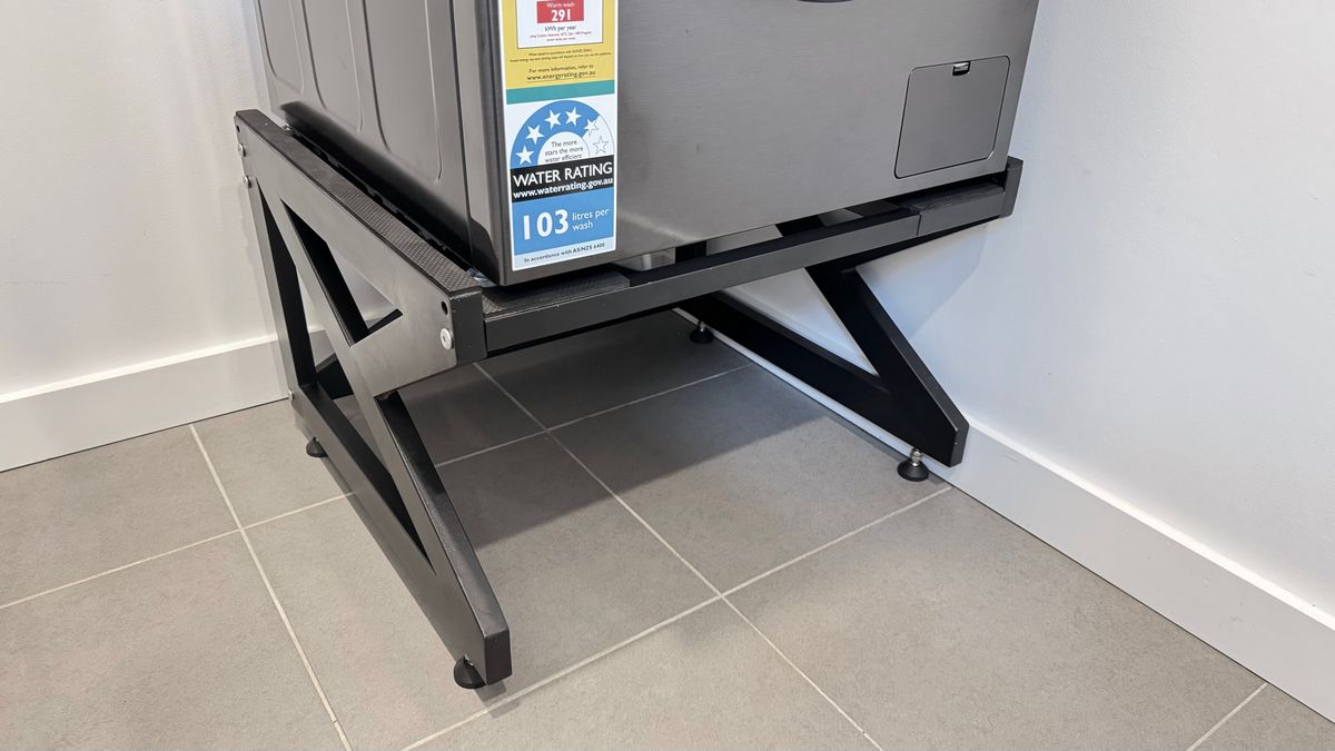 Real Space Washerbase showing a DryerStand freestanding tumble dryer stand in a real laundry space with a dryer above a washing machine
