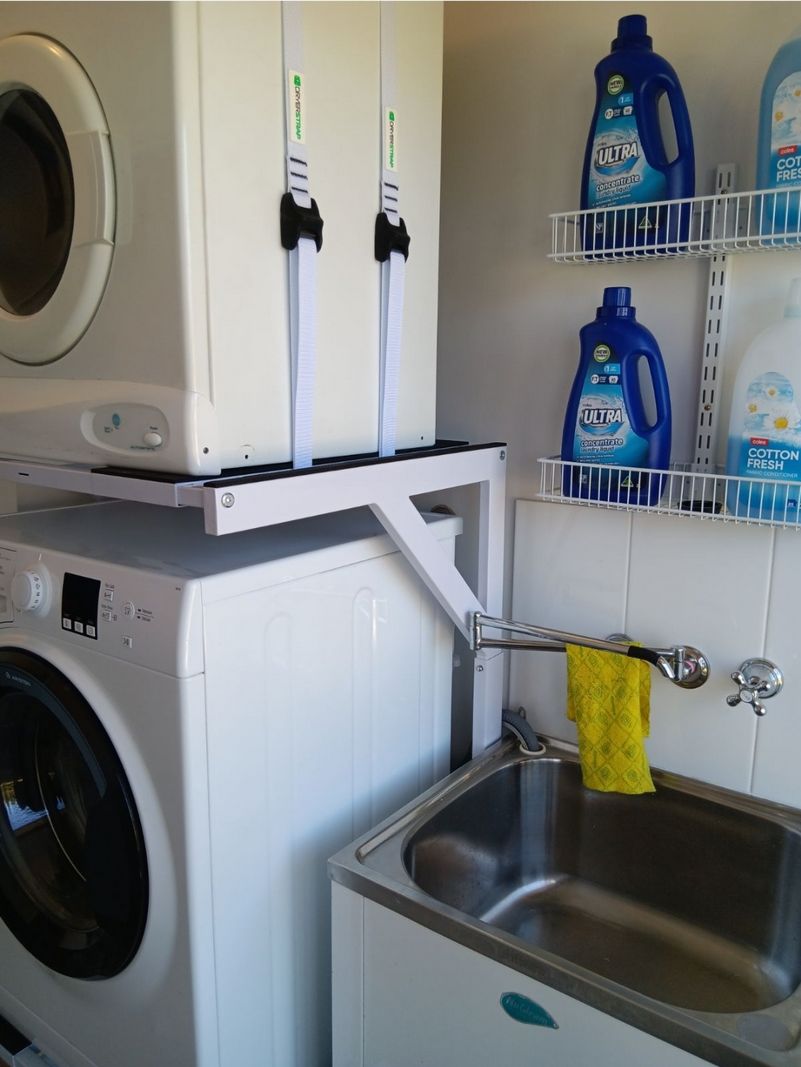 Real Space DryerStand Maxi showing a DryerStand freestanding tumble dryer stand in a real laundry space with a dryer above a washing machine